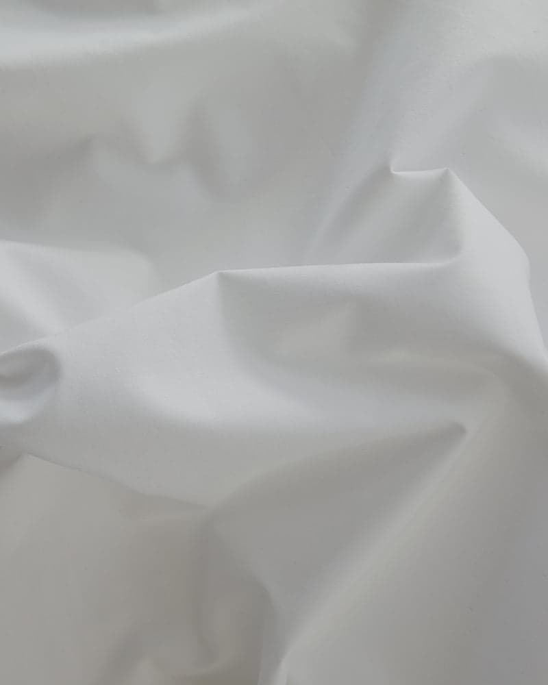 Nahaufnahme des gewebten Baumwollstoffs des FamBed Bedskirts
